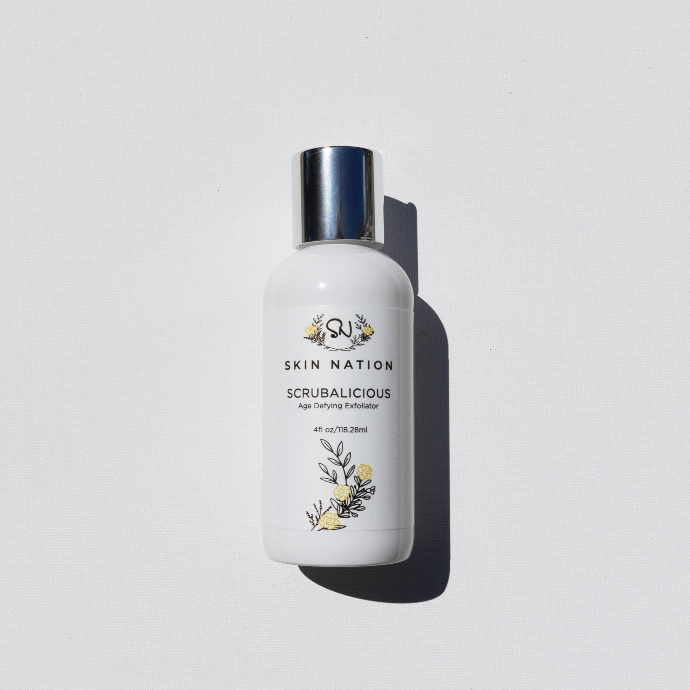 Skincare bottle of Scrubalicious labeled 'Skin Nation' on a light gray background