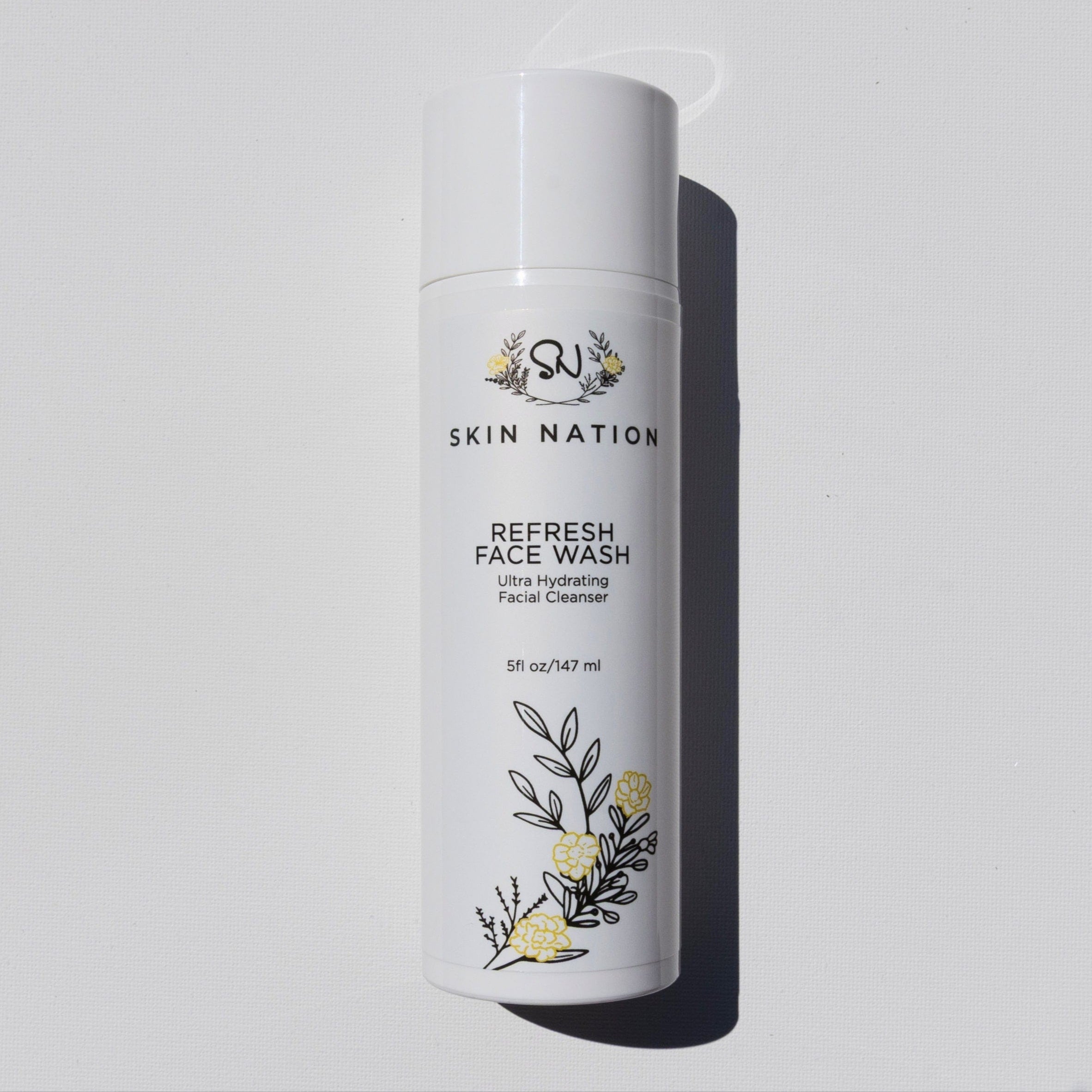 Skin Nation face wash bottle on a light gray background