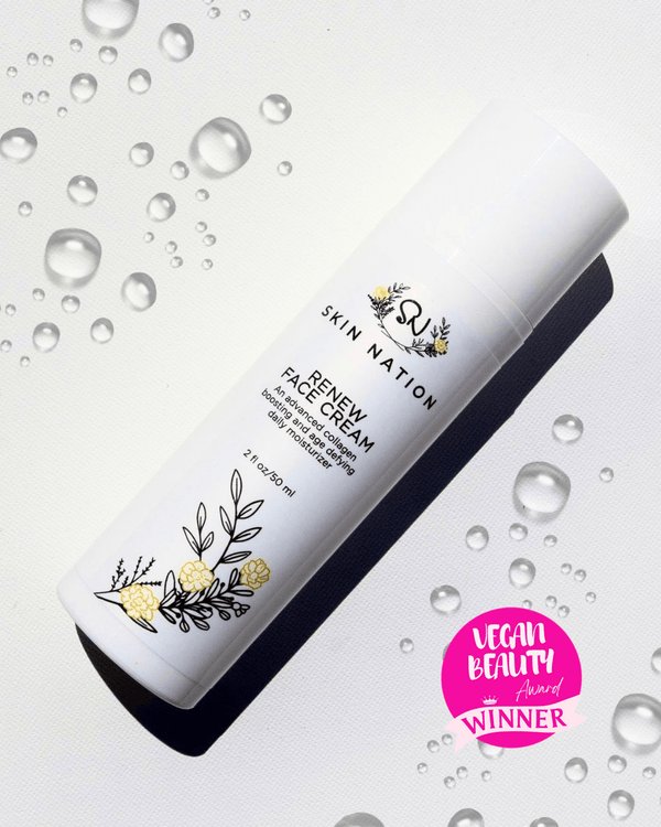 Skin Nation Renew Face Cream bottle with water droplets on a light background with a Vegan Beauty Award Winner Logo