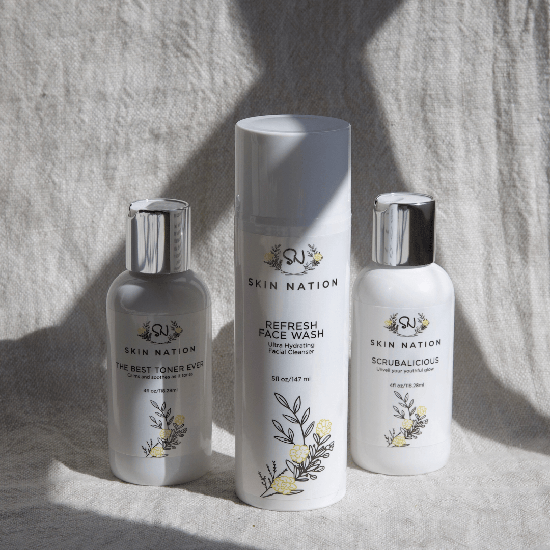 Three Skin Nation skincare products included in the Fascination Combination on a textured surface with natural light.